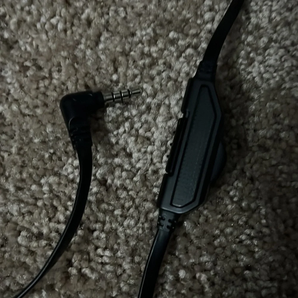 Slightly used PlayStation headset with microphone. With audio adjuster on wire.
